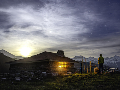 Mountain cabin at sunset